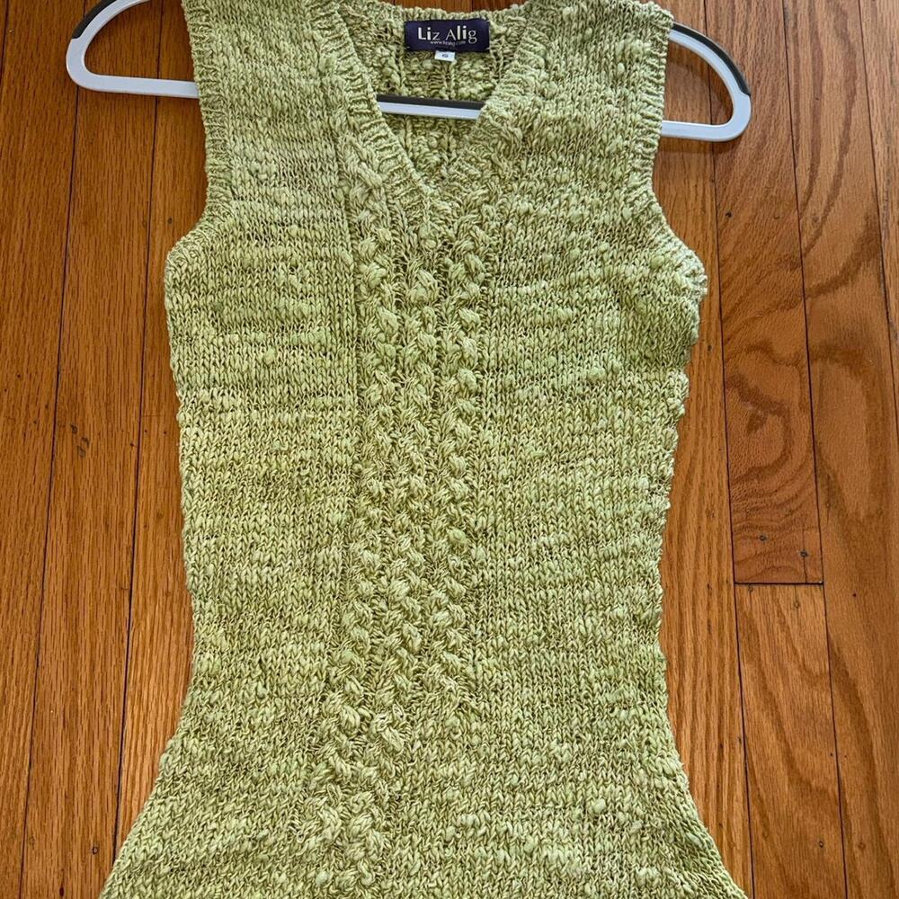 green knit mini dress with textured detailing + deep v neckline.